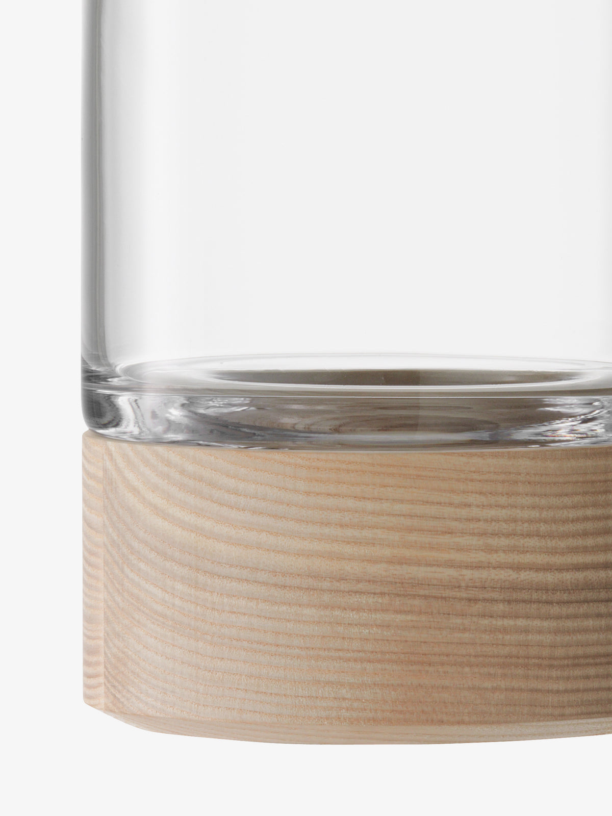 A close-up of the lsa-international Vase/Lantern featuring a clear glass vessel resting on a cylindrical ash base with visible wood grain.