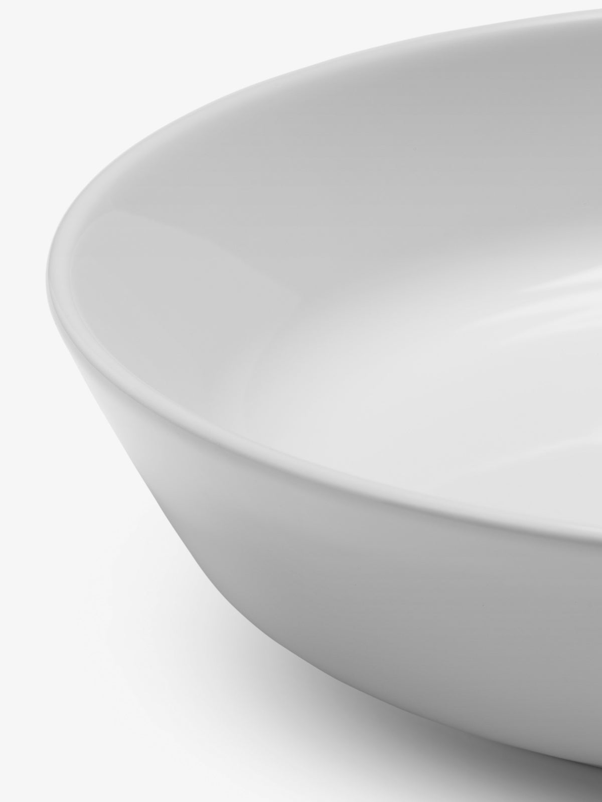 Close-up view of a shallow, white, wide-rimmed lsa-international Pasta/Serving Bowl.