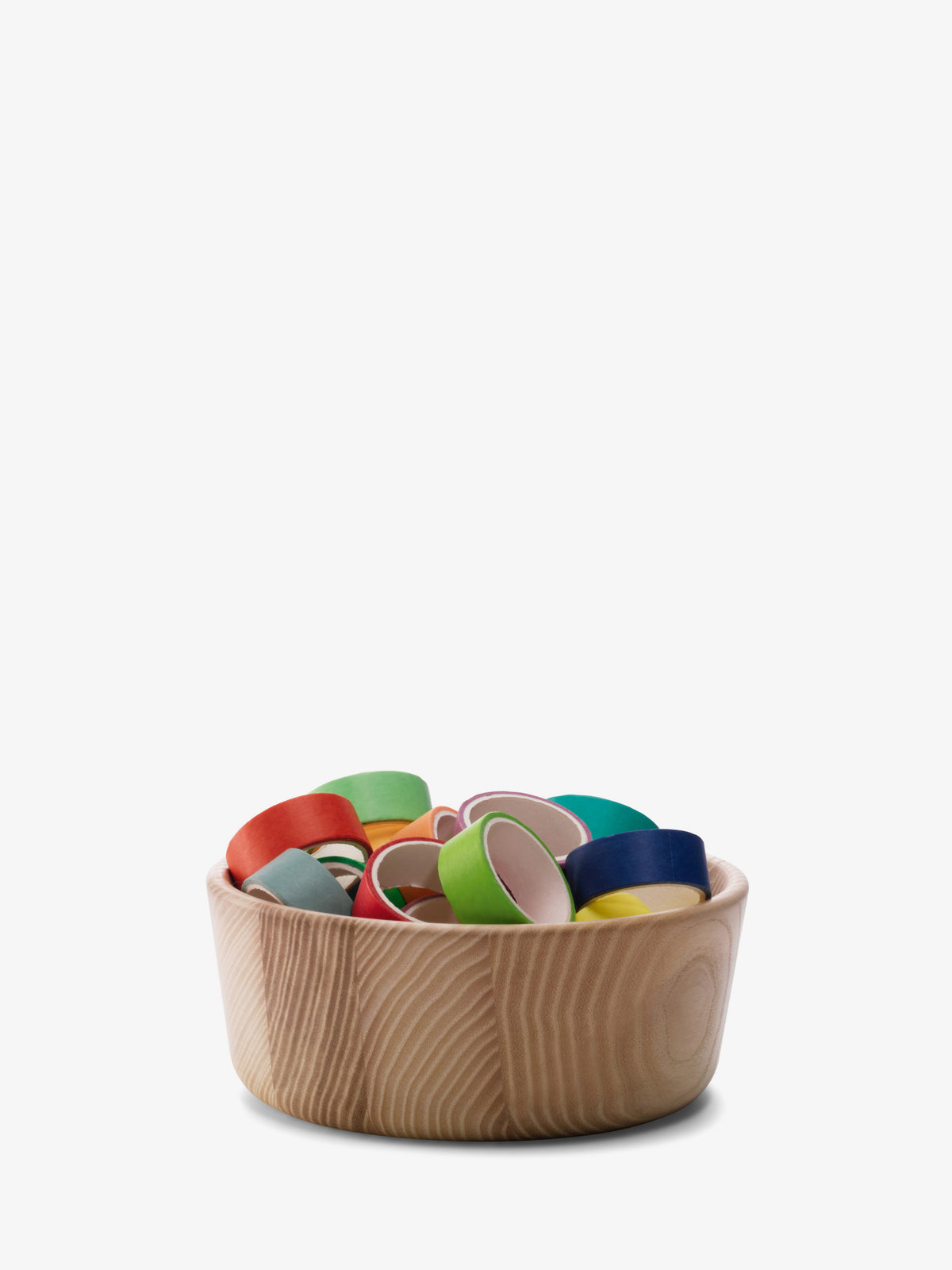 An LSA International Ash Wood Bowl filled with several colorful rolls of washi tape.