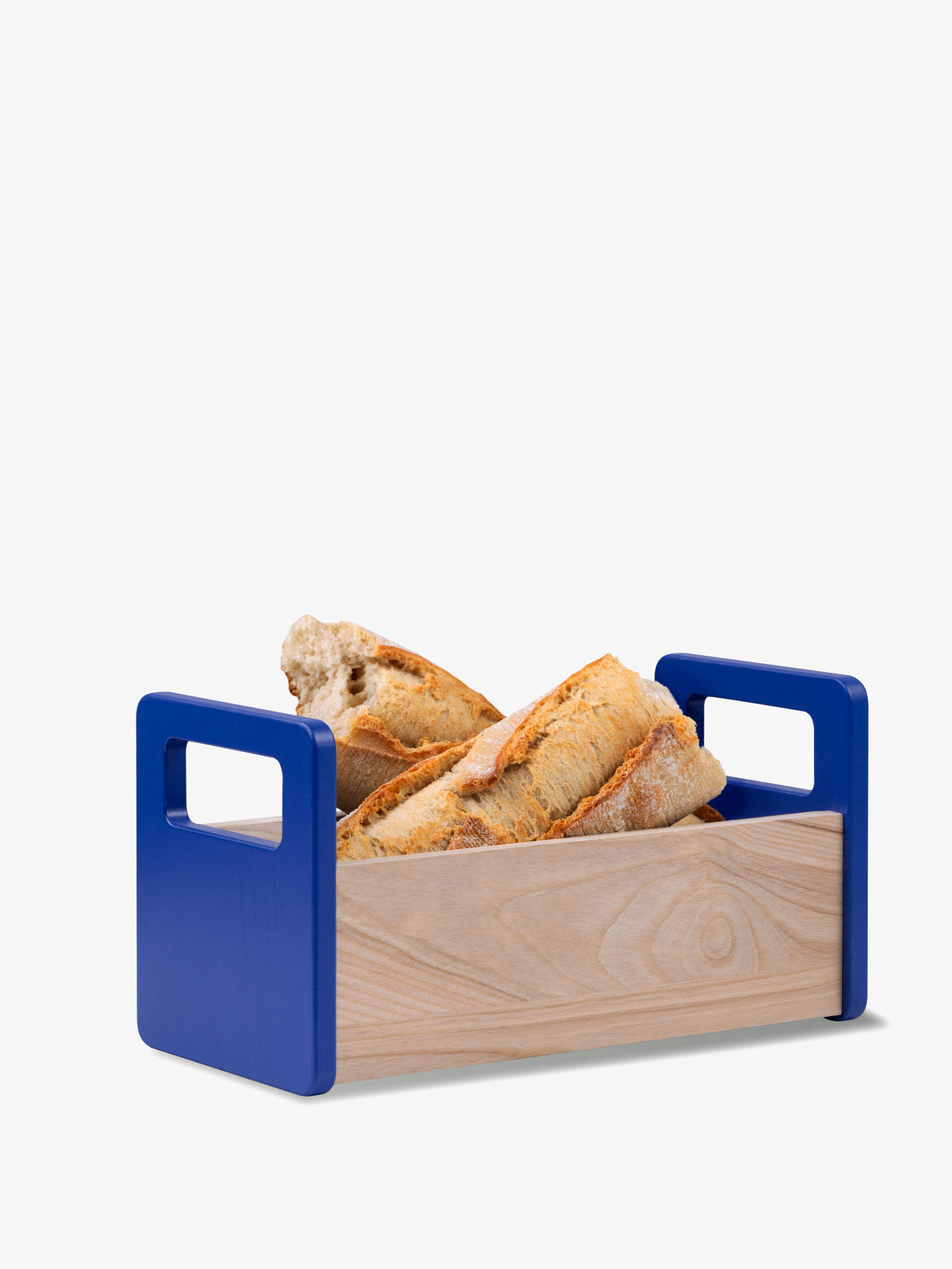 Two crusty baguettes in an Ash Bread Basket with a minimalist wooden design and blue handles.