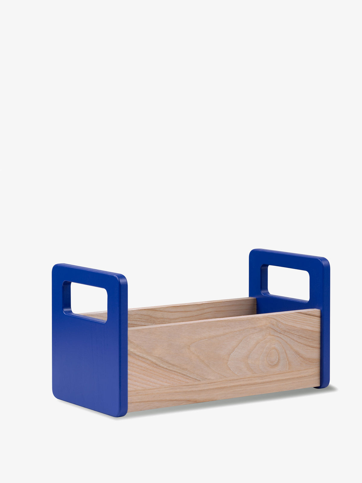 Minimalist Ash Bread Basket in European ash with vibrant blue handles on each end.