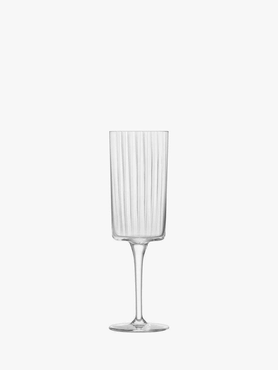 A lsa-international Champagne Flute with a clear, ribbed design, long stem, and flat base showcases a modern silhouette reminiscent of elegant champagne flutes, centered against a plain white background.