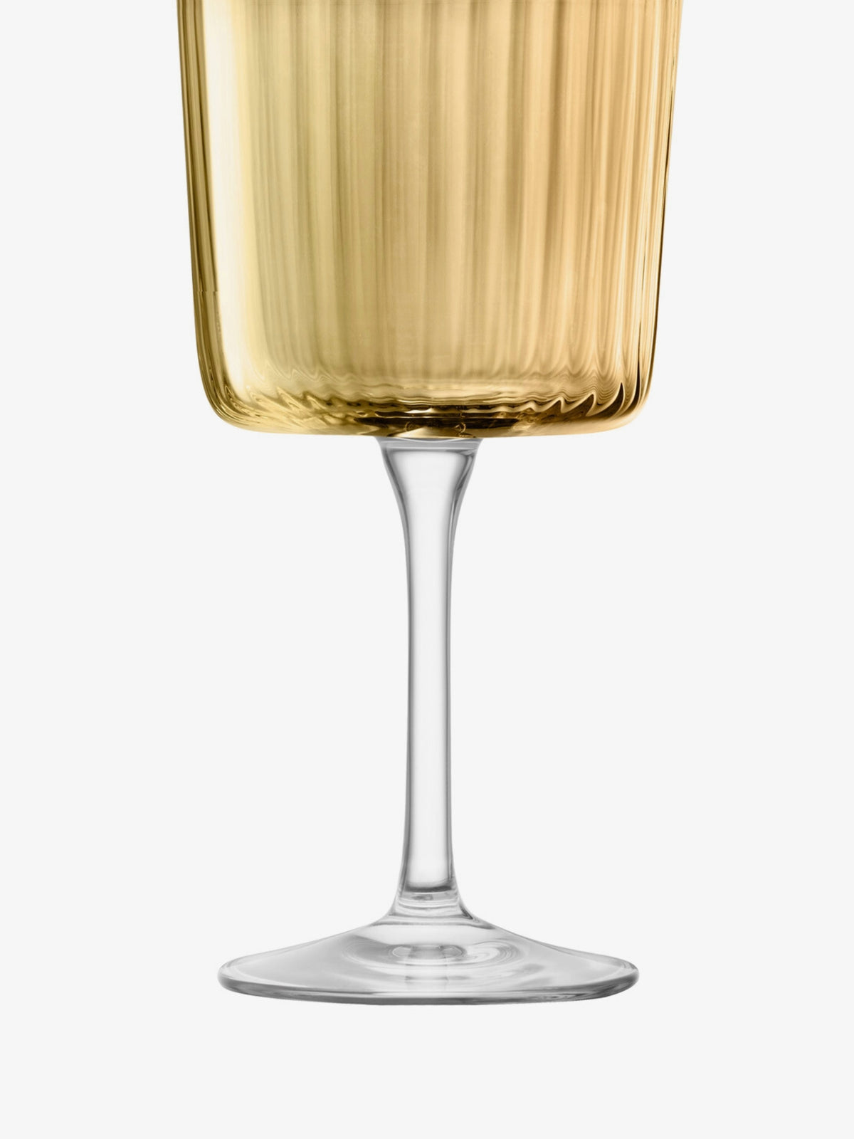 A close-up of the lower half of a gold-tinted, ribbed wine glass with a clear stem and base against a plain white background.