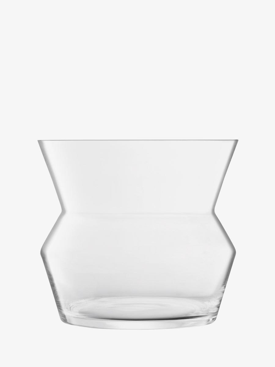 The lsa-international Vase/Lantern is a clear, mouth-blown piece with a modern geometric silhouette—widest at the top and base, tapering to a narrower center—set against a white background.