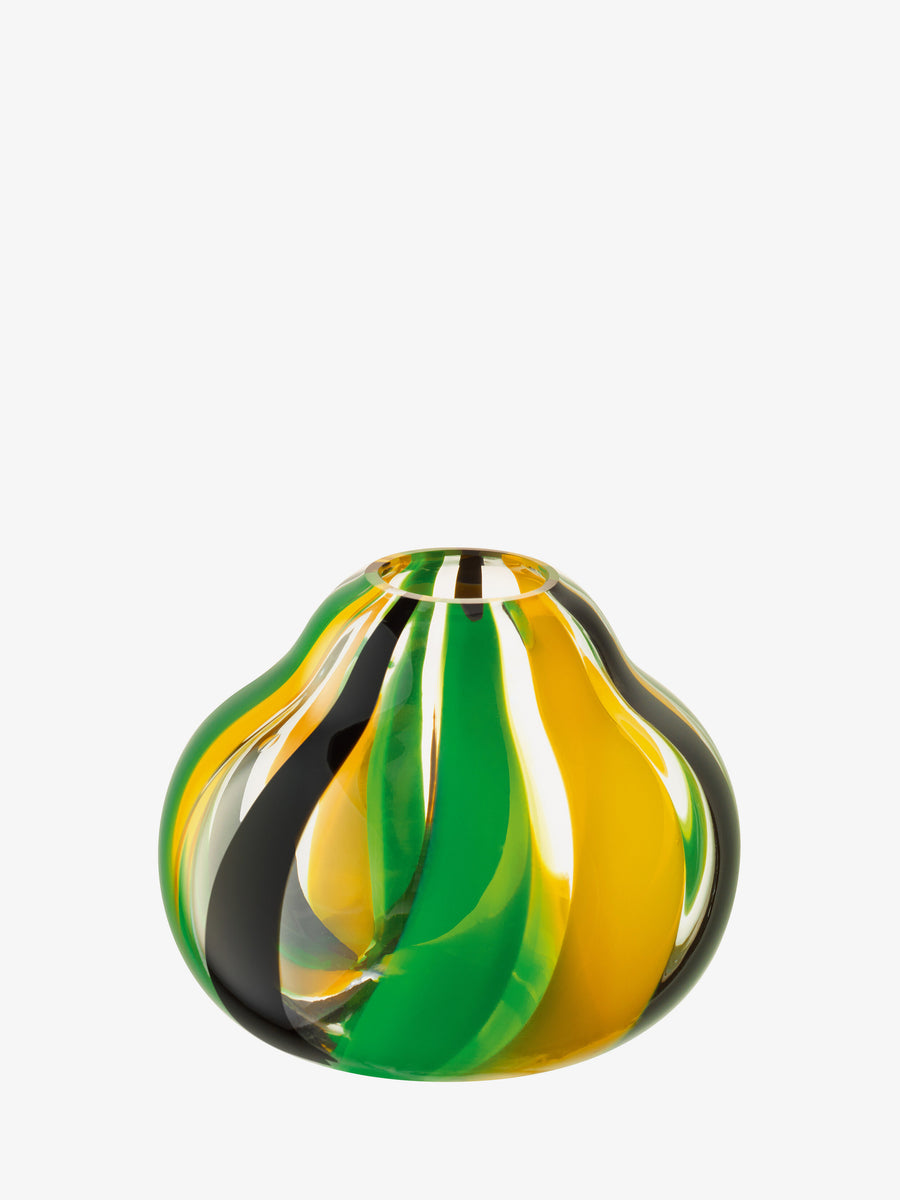 The lsa-international Vase is a mouth-blown glass piece with a bulbous silhouette, adorned with wavy stripes in green, yellow, and black that create a subtle folk-inspired pattern. With its rounded form and small top opening, this vase stands out as an eye-catching table centrepiece against a white background.