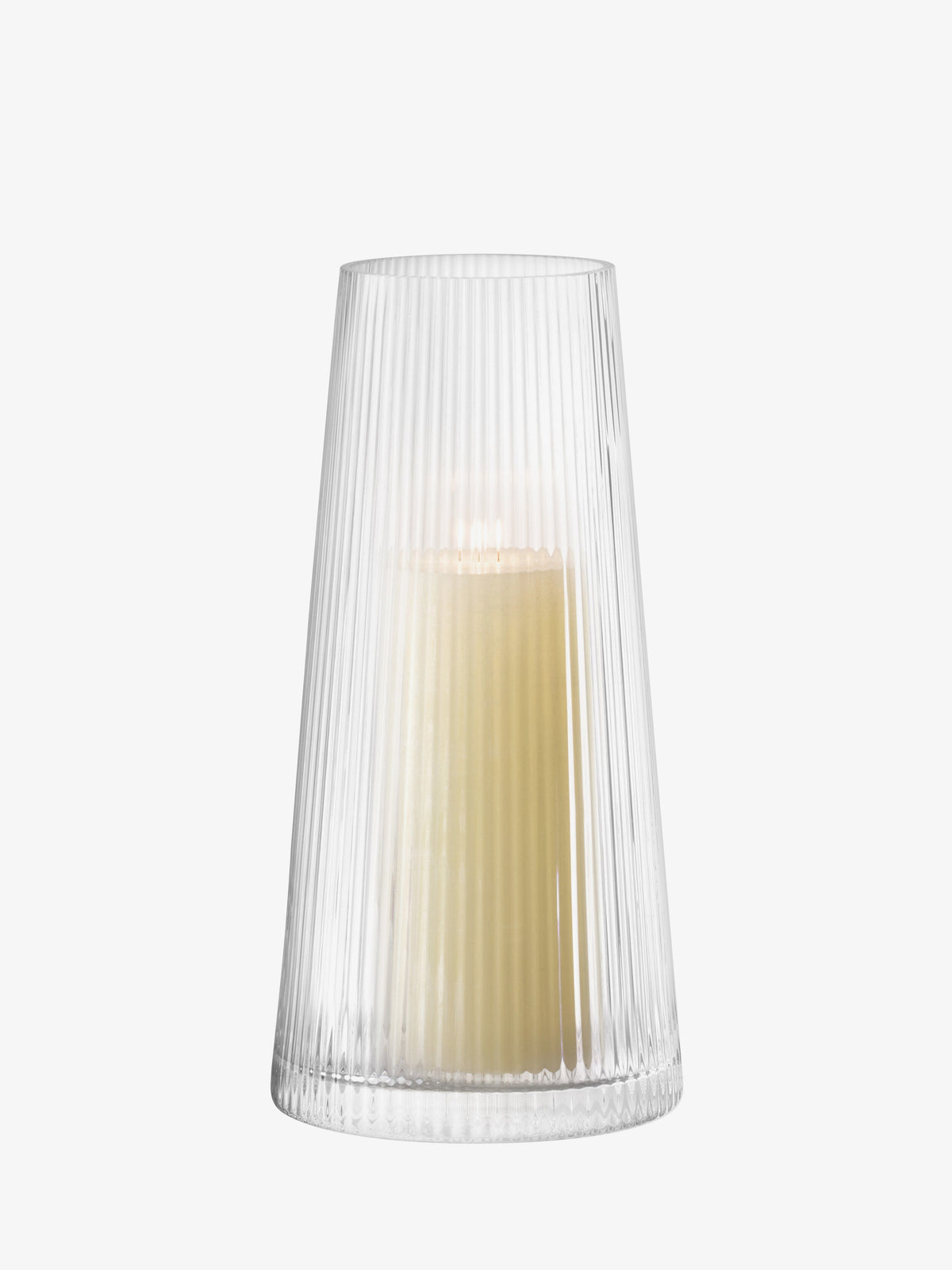 LSA International Lantern/Vase, a tall, tapered, ribbed glass vessel holding a lit pillar candle for ambient light.