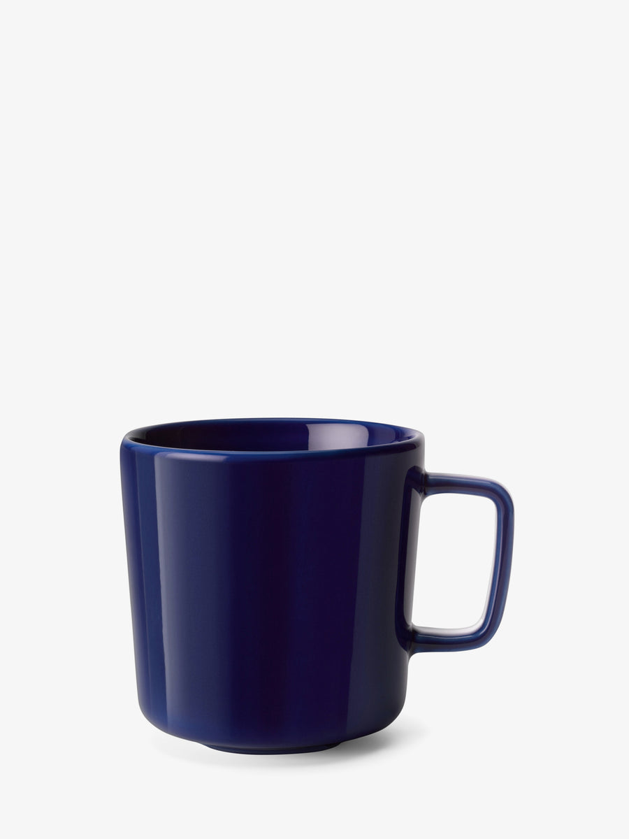 A dark blue ceramic Mug by lsa-international, featuring a rectangular handle and crafted as part of contemporary tableware, displayed on a plain white background.