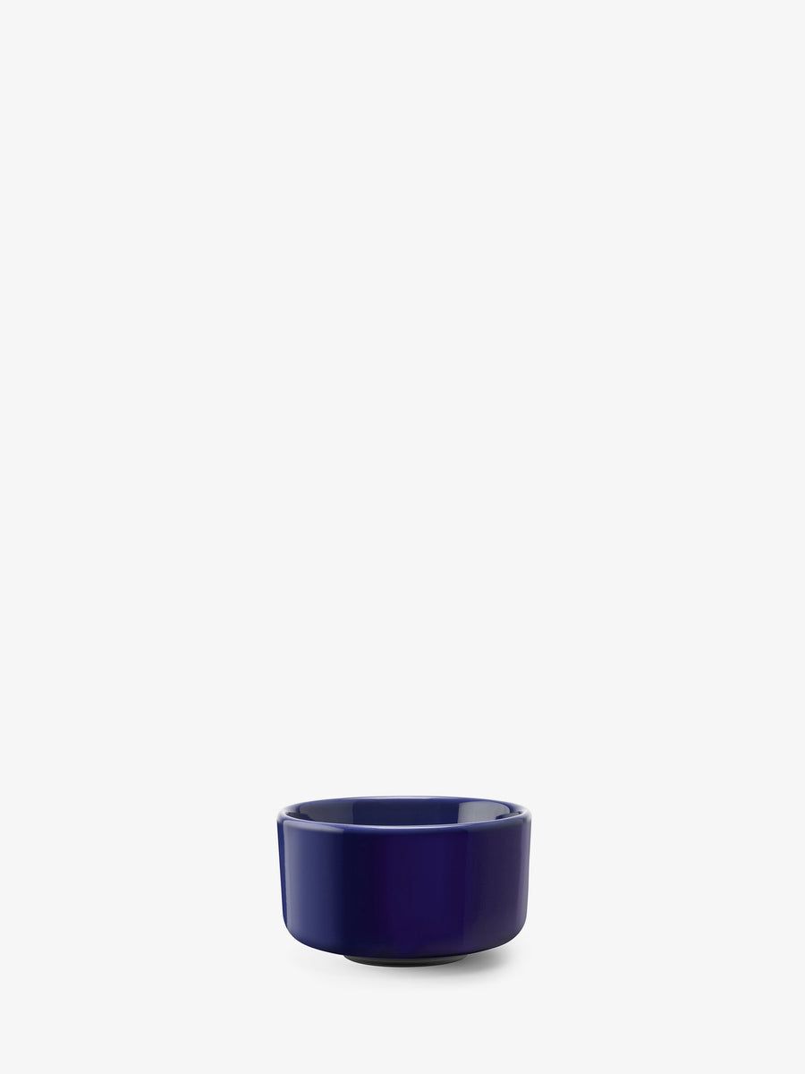 The lsa-international Small Bowl, crafted from deep blue ceramic, sits on a plain white background and showcases a beautiful example of contemporary tableware.